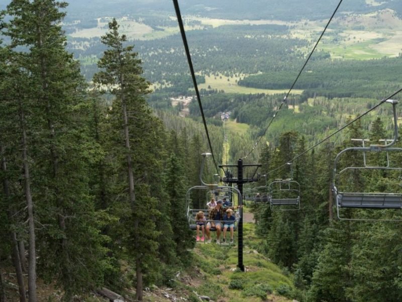 Sees from Arizona Snowbowl's chairlift go from cold white to verdant green throughout the mid year.